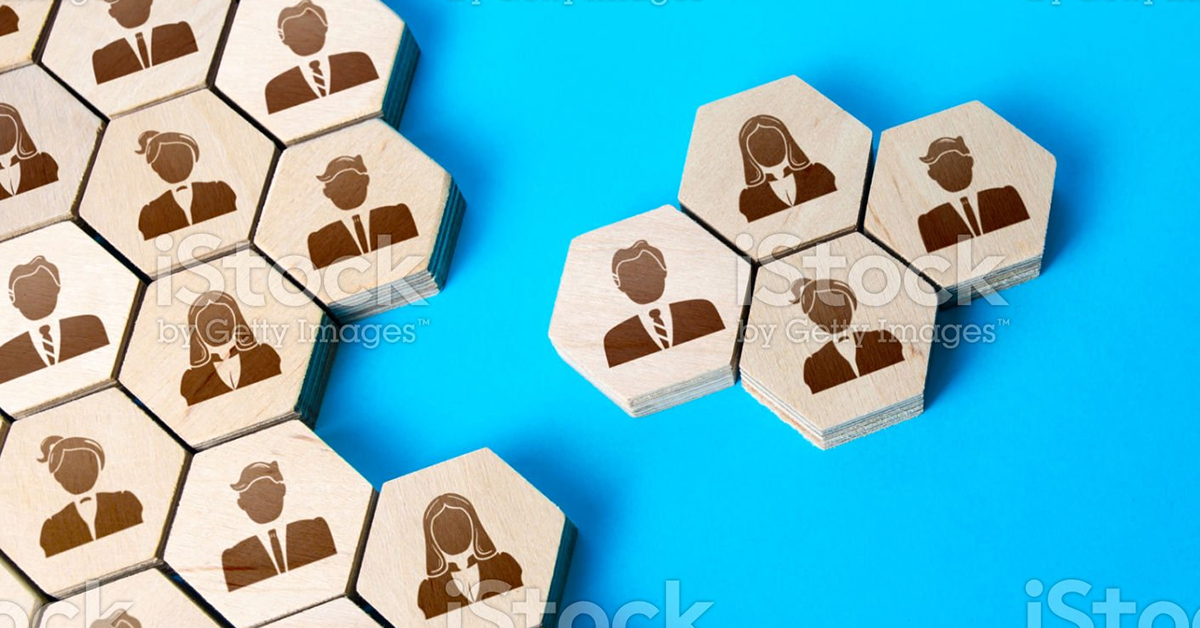 Two groups of wooden tiles with people, meshing together